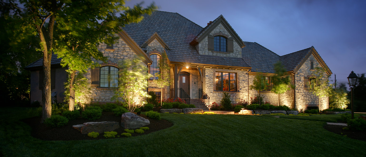 architectural and front yard lighting on a stone house
