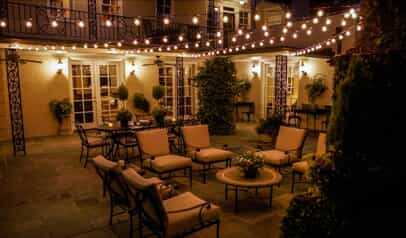 Outdoor patio with overhead twinkle lights and beautiful outdoor lighting