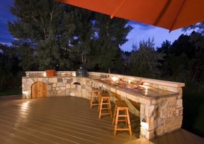 outdoor patio and bar lit with outdoor lighting