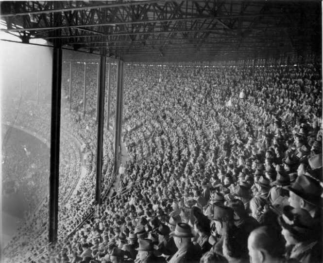 Black and white image of a stadium filled with people