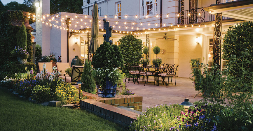 Outdoor string lights in backyard patio