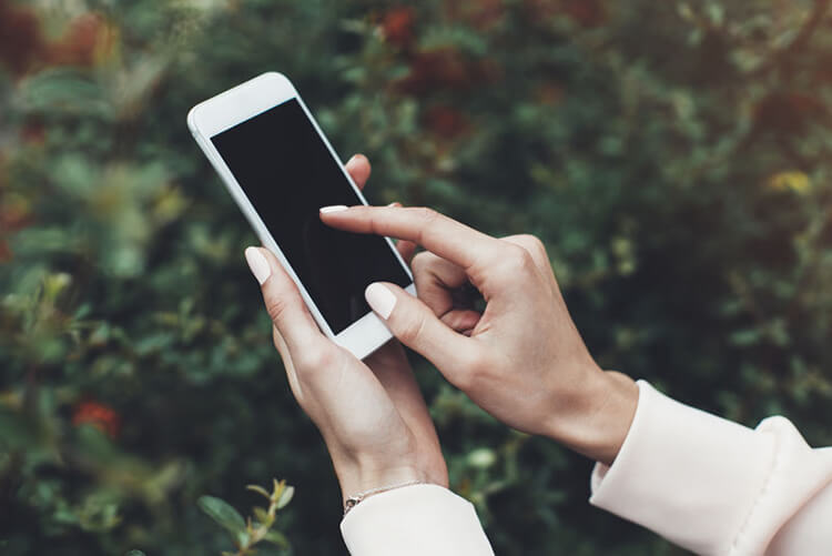 Hands using smart phone