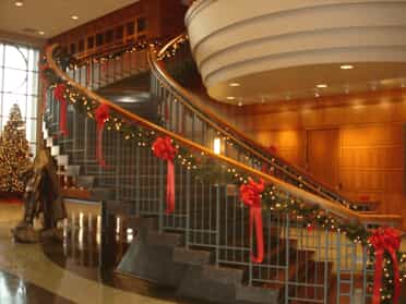 Christmas wreaths and garland on staircase
