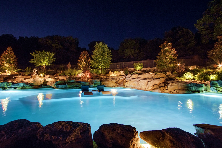 large pool with outdoor lighting 