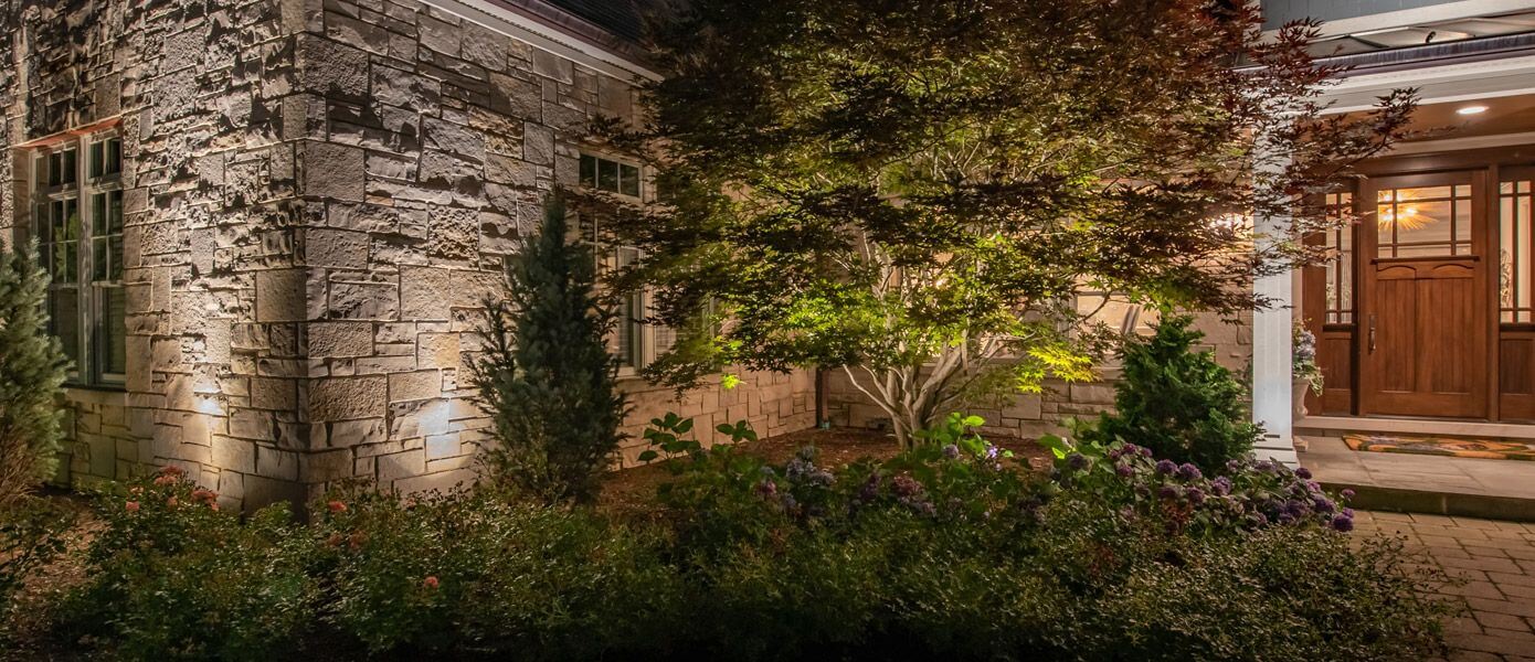 landscape lighting around front yard of residential home in East Memphis