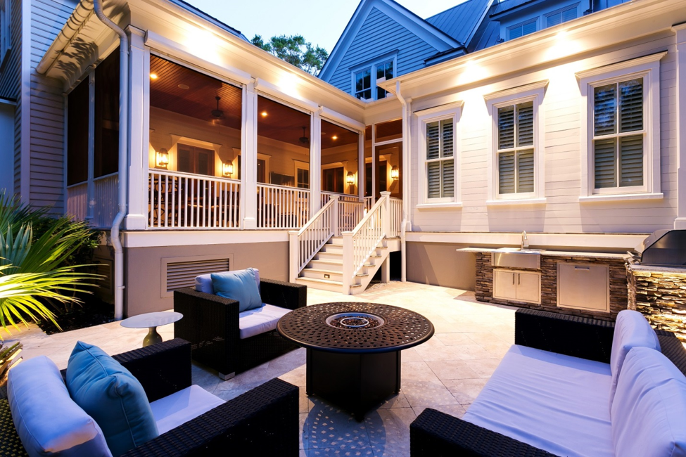 patio lighting with couches and chairs around fire pit
