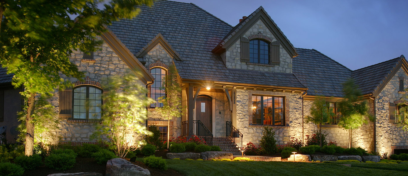 front of a Germantown house lit with outdoor lighting 