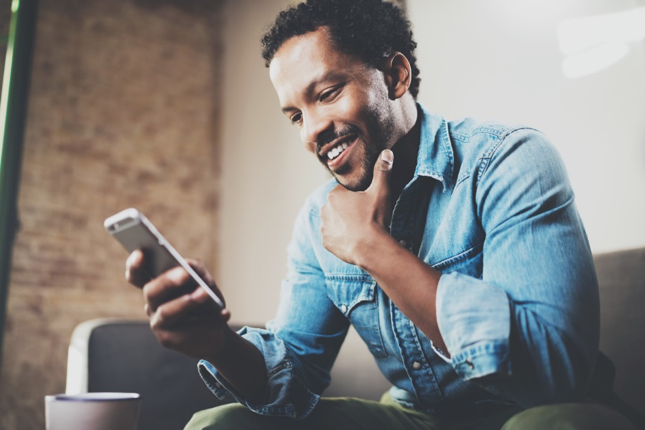 man looking at his cell phone