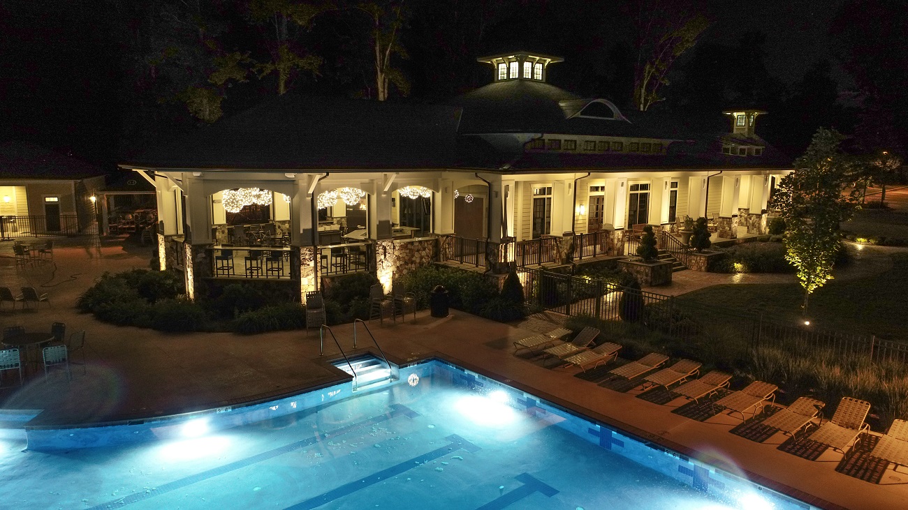 clubhouse with outdoor lighting