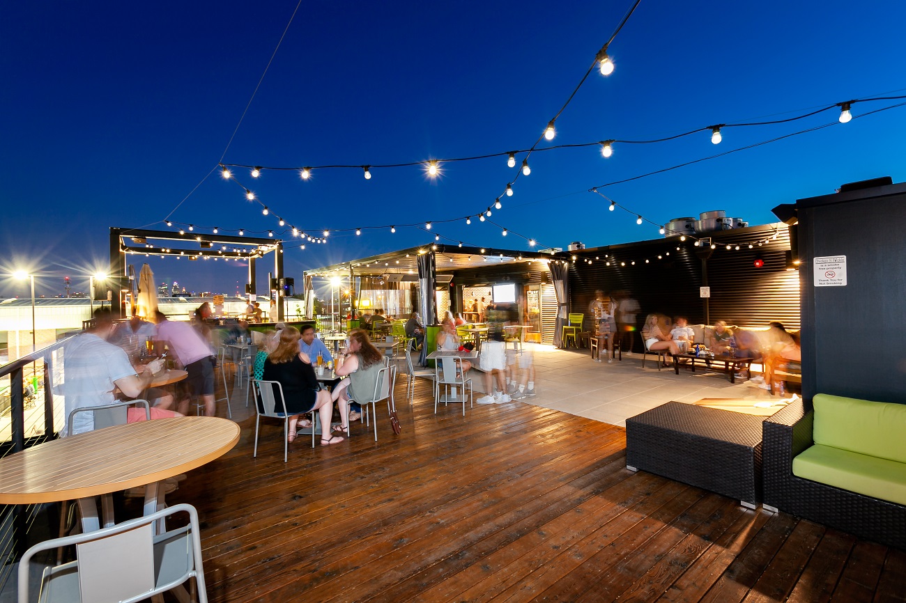 restaurant patio with string lights and people