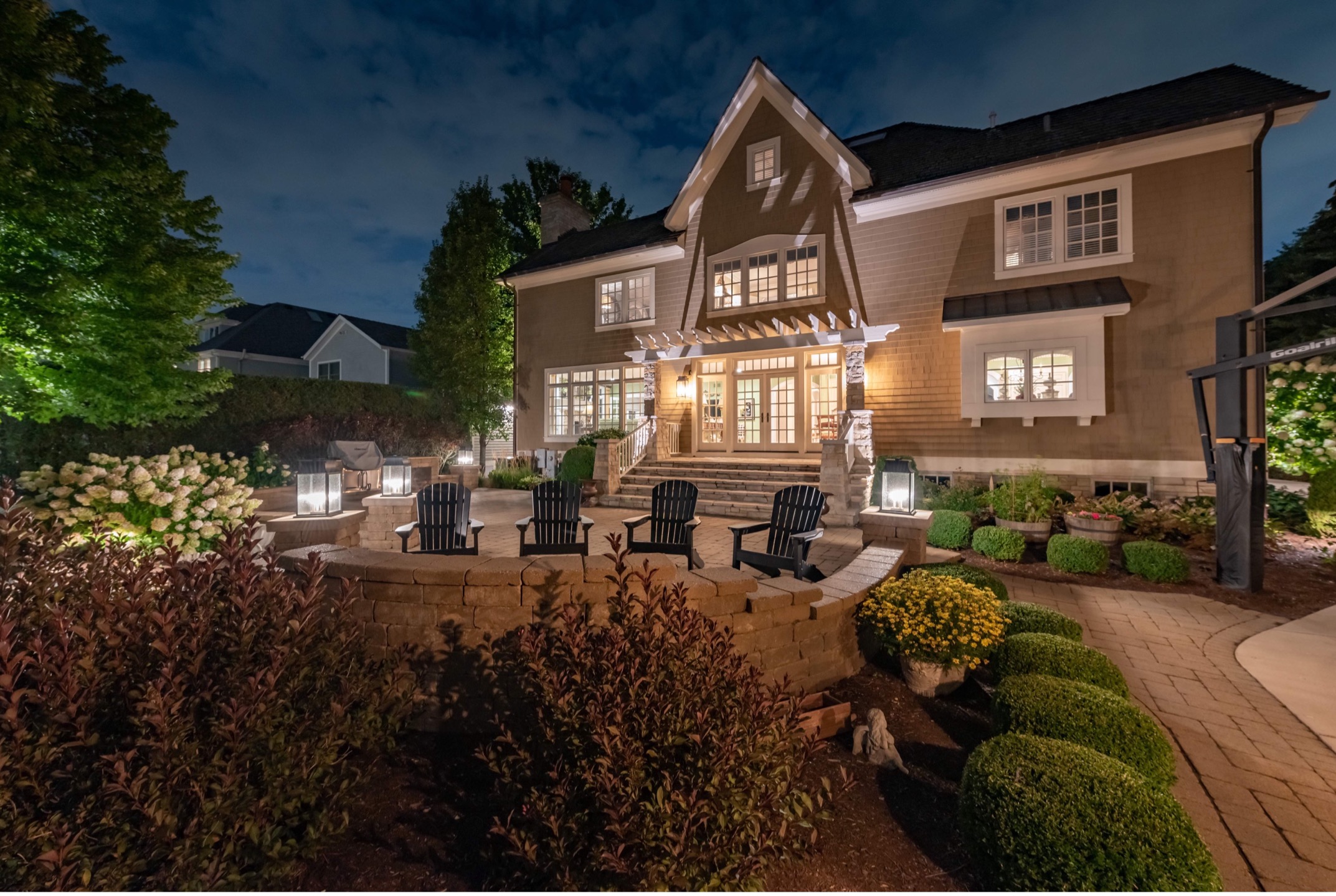 A house with a patio and lawnDescription automatically generated