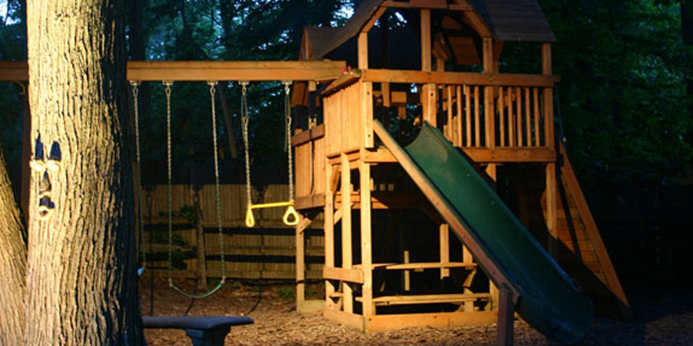 Outdoor child's play area with moonlighting