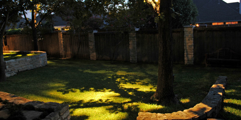 Residential yard with landscape lighting