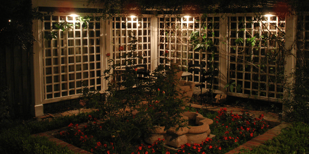 Courtyard with a fountain and rose bushes
