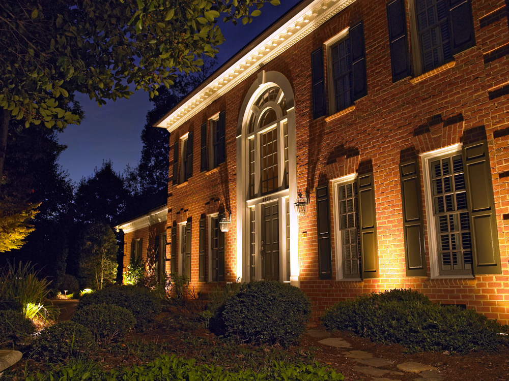 brick home facade after exterior lights installation in plymouth