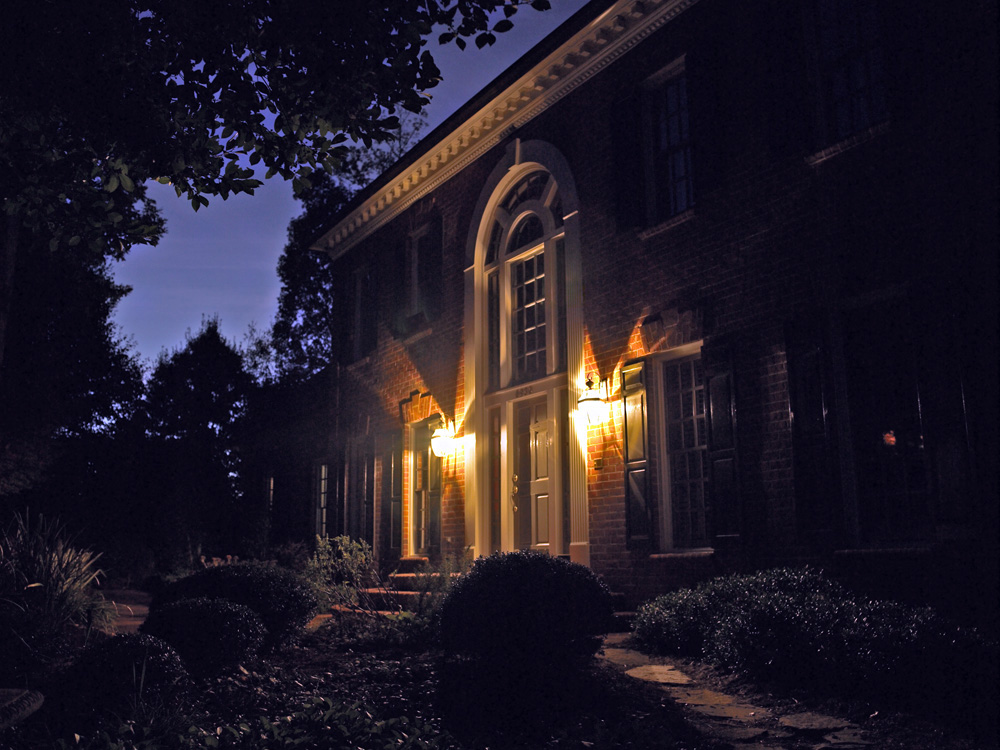 brick home facade before exterior lighting service in plymouth