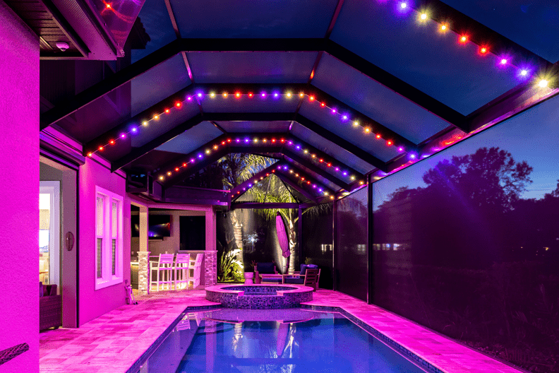 covered pool with Permanent Roofline Lighting