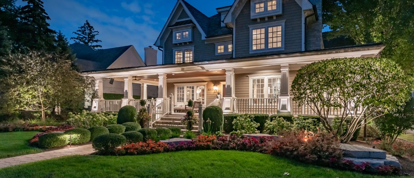 home with custom outdoor lighting
