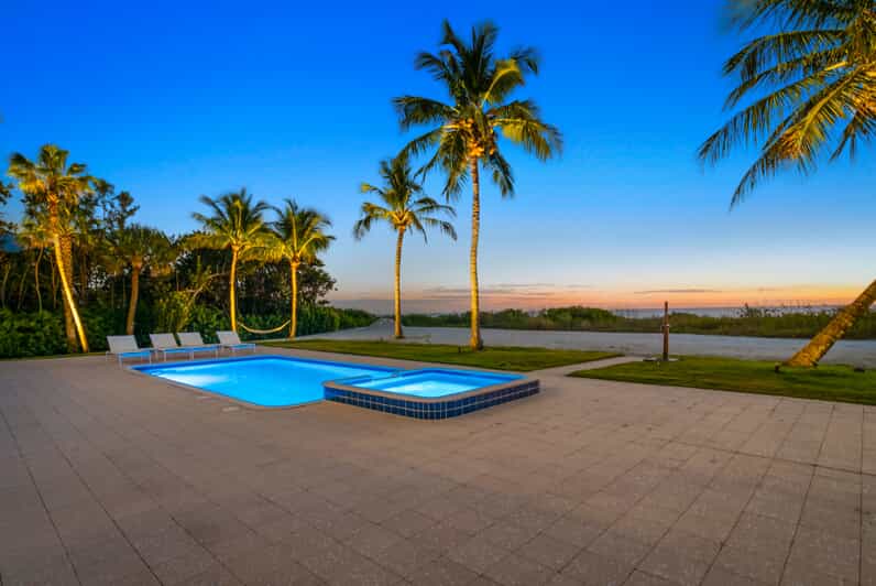 pool lighting on palm trees