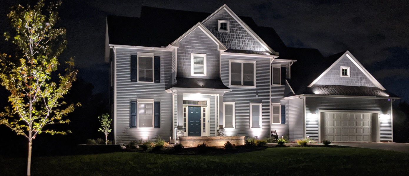 A house with lights on itDescription automatically generated