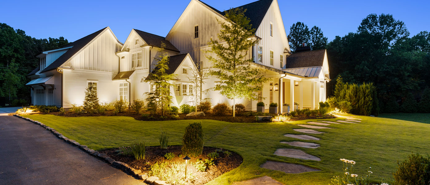 A house with a lawn and walkwayDescription automatically generated