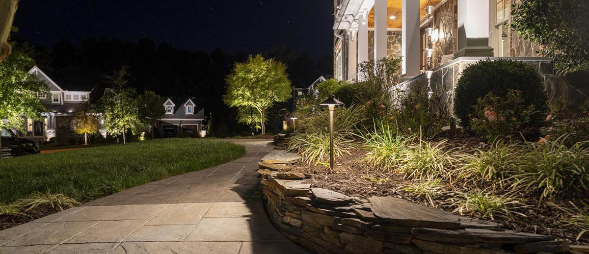 A house with a stone walkway and a lawn