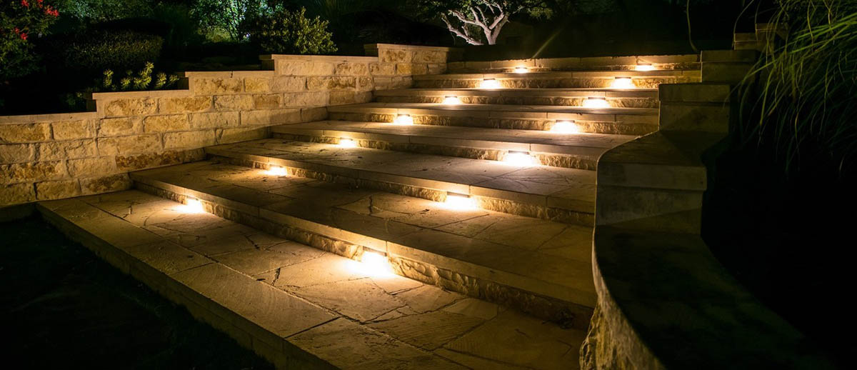A house with a stone walkway and a lawn