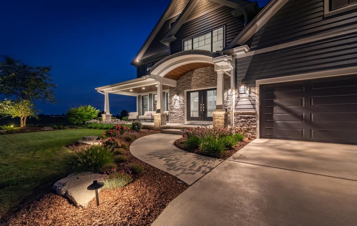 home with landscape lighting 