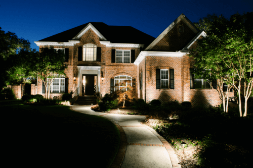 Residential house driveway with outdoor lights