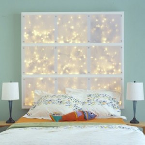 using string lights to add interest to white bedroom walls