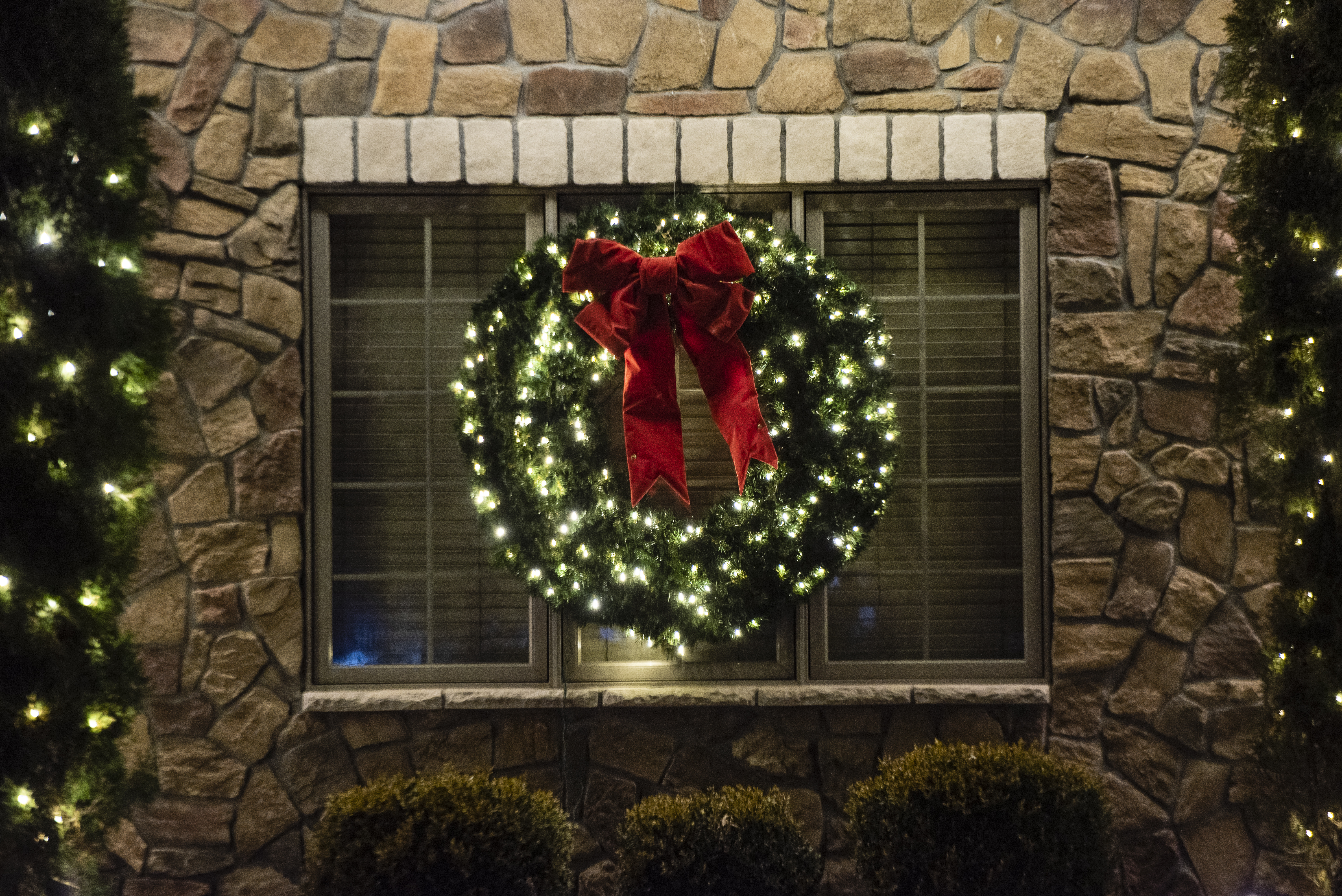 lit up wreath on window