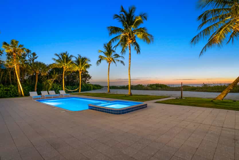 pool lighting with palm trees