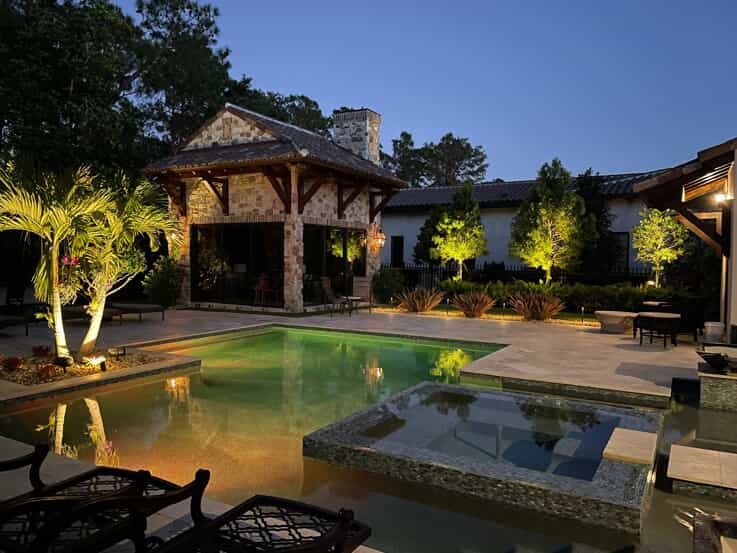 outdoor lighting around a pool oasis